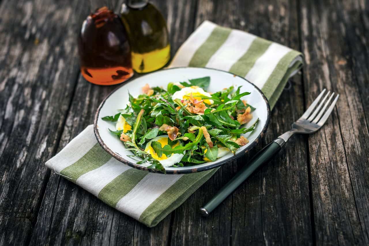 Dandelion salad with eggs and bacon salad