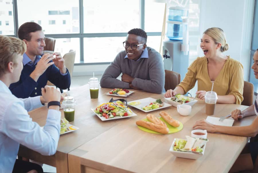 box-lunch-catering-baltimore-900×604 business team sitting around table eating lunch